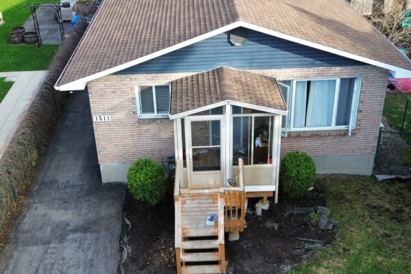 Leaves being raked and removed in Orléans Ottawa yard